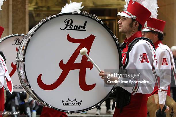 The Alabama Million Dollar Band marches in the Peach Bowl Parade during the College Football Playoff Semifinal at the Chick-fil-A Peach Bowl between...