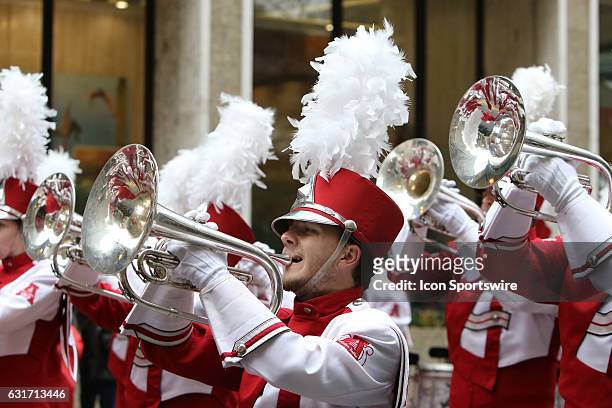 The Alabama Million Dollar Band marches in the Peach Bowl Parade during the College Football Playoff Semifinal at the Chick-fil-A Peach Bowl between...