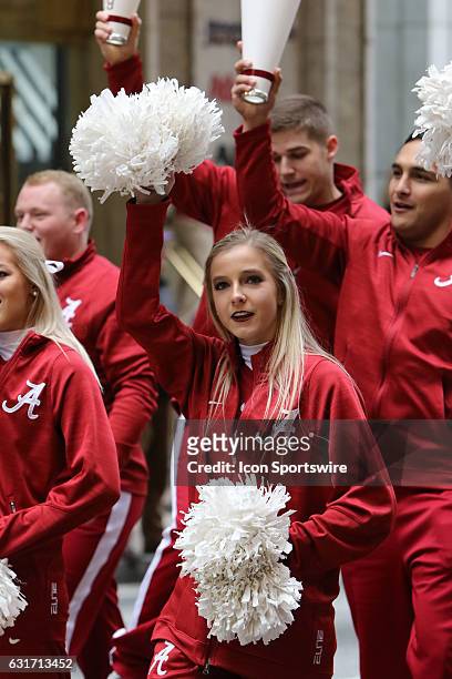 Alabama Crimson Tide cheerleaders march in the Peach Bowl Parade during the College Football Playoff Semifinal at the Chick-fil-A Peach Bowl between...