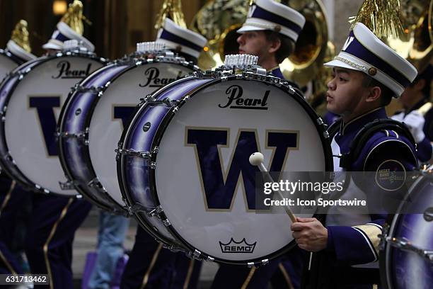 The Washington Huskies band marches in the Peach Bowl Parade before the College Football Playoff Semifinal at the Chick-fil-A Peach Bowl between the...