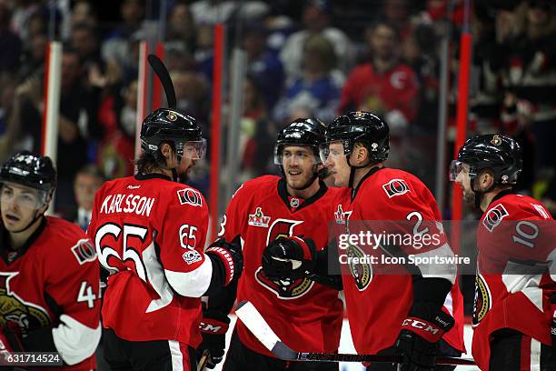 Ottawa Senators Defenceman Erik Karlsson Ottawa Senators Left Wing Mike Hoffman and Ottawa Senators Defenceman Dion Phaneuf celebrate a goal in the...