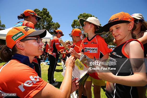 Lauren Ebsary of the Scorchers signs autographs after winning the Women's Big Bash League match between the Melbourne Stars and the Perth Scorchers...