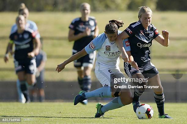 Laura Alleway of Melbourne City and Natashia Dowie of Melbourne Victory compete for the ball during the round 12 W-League match between Melbourne...