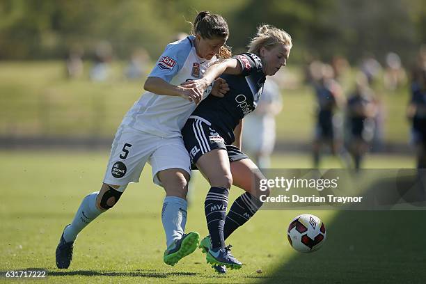 Laura Alleway of Melbourne City and Natashia Dowie of Melbourne Victory compete for the ball during the round 12 W-League match between Melbourne...