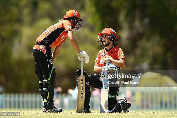 Lauren Ebsary and Heather Graham of the Scorchers talk mid wicket during the Women's Big Bash League match between the Melbourne Stars and the Perth...