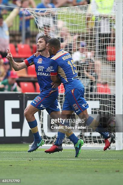 Mateo Poljak of the Jets celebrates a goal with team mate Andrew Nabbout during the round 15 A-League match between the Newcastle Jets and the Perth...