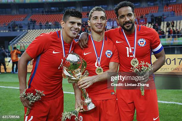 Esteban Pavez, Carlos Carmona and Jean Beausejour of Chile poses withtrophy after winning the final match of 2017 Gree China Cup International...