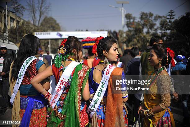 Nepalese Tharu community people in a traditional attire during prade of the Maghi festival celebrations, or the New Year of the Tharu community at...