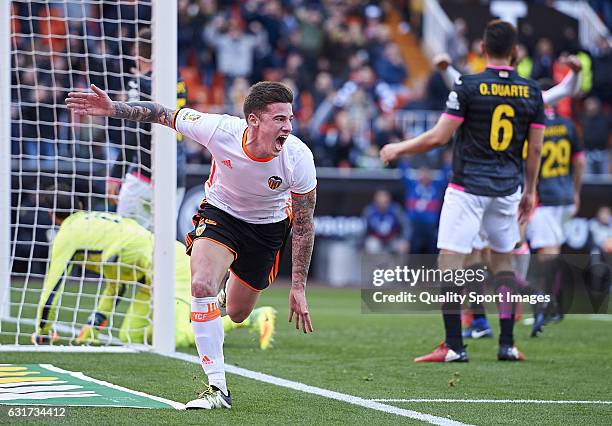 Santi Mina of Valencia celebrates after scoring the second goal during the La Liga match between Valencia CF and RCD Espanyol at Mestalla Stadium on...