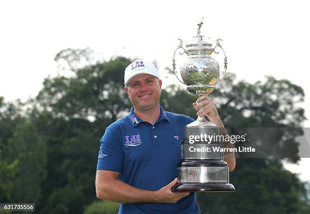 Graeme Storm of England poses with the trophy after winning the BMW South African Open Championship at Glendower Golf Club on January 15, 2017 in...