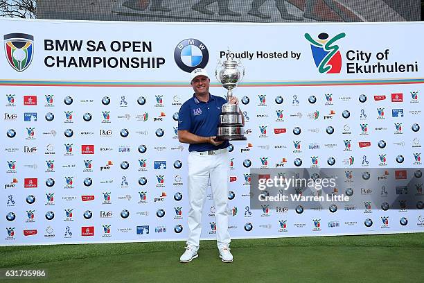 Graeme Storm of England celebrates with the trophy after winning the BMW South African Open Championship at Glendower Golf Club on January 15, 2017...