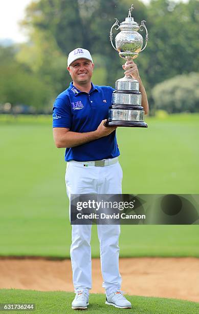 Graeme Storm of England celebrates with the trophy after winning the BMW South African Open Championship at Glendower Golf Club on January 15, 2017...