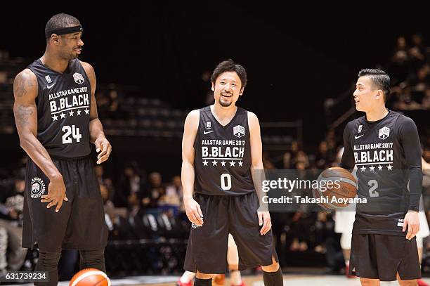 Justin Burrell, Yuta Tabuse and Yuki Togashi of the B.Black looks on prior to the B league Allstar Game match between B Black and B White as part of...