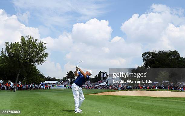 Graeme Storm of England plays his second shot into the 18th green during the final round of the BMW South African Open Championship at Glendower Golf...