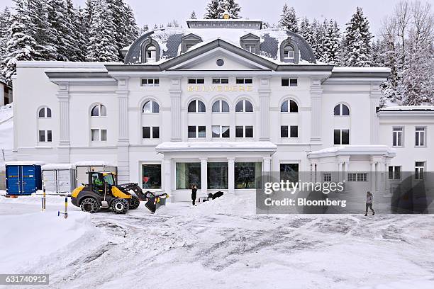 Bulldozer clears snow in front of the Belvedere hotel in Davos, Switzerland, on Sunday, Jan. 15, 2017. World leaders, influential executives, bankers...