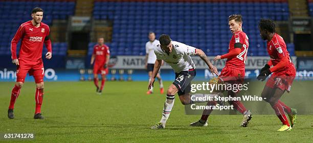 Bolton Wanderers' Gary Madine battles with Swindon Town's Charlie Colkett during the Sky Bet League One match between Bolton Wanderers and Swindon...