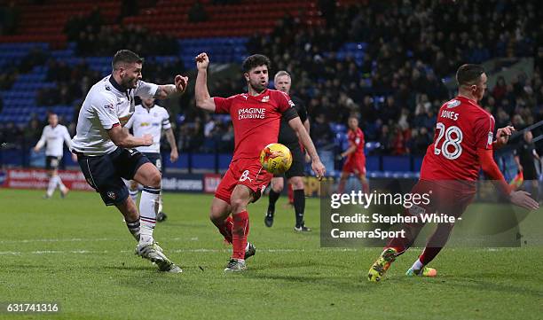 Bolton Wanderers' Gary Madine sees his shot rebound of Swindon Town's Lloyd Jones during the Sky Bet League One match between Bolton Wanderers and...