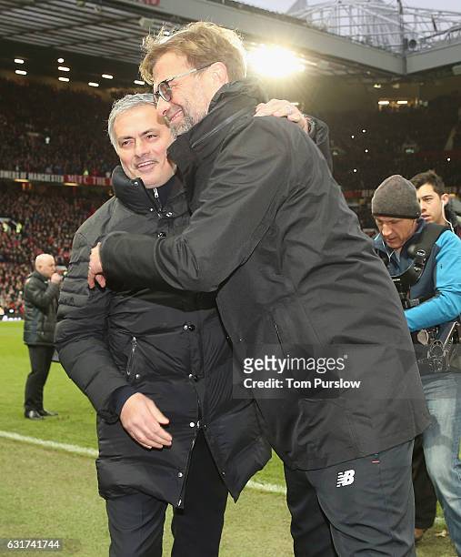 Manager Jose Mourinho of Manchester United greets Manager Jurgen Klopp of Liverpool ahead of the Premier League match between Manchester United and...