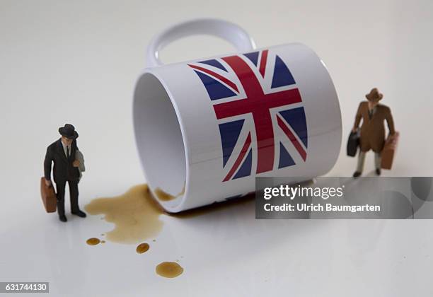 Hard Brexit soft Brexit? Waiting for the decisions of the British government. The photo shows an overturned coffee cup with British flag and...