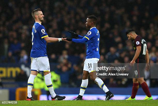 Morgan Schneiderlin and Ademola Lookman of Everton celebrate their team's 4-0 victory during the Premier League match between Everton and Manchester...