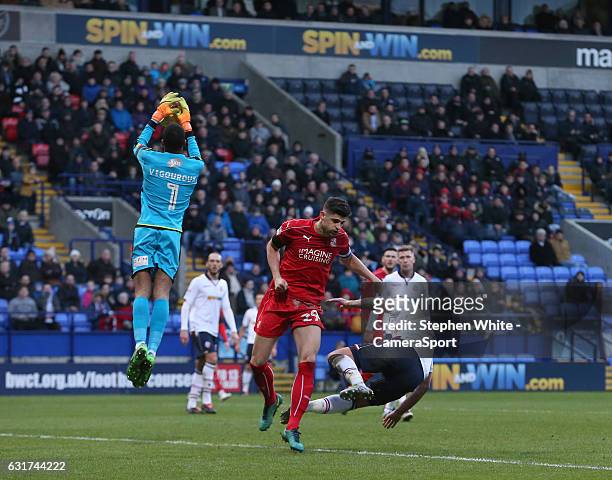 Swindon Town's Raphael Rossi Branco impedes Bolton Wanderers' Gary Madine in an incident of the ball unseen by Referee Mark Heywood during the Sky...