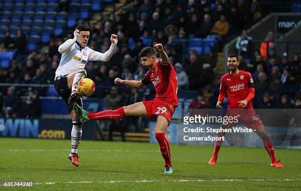 Bolton Wanderers' Zach Clough battles with Swindon Town's Raphael Rossi Branco during the Sky Bet League One match between Bolton Wanderers and...