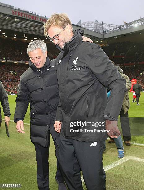 Manager Jose Mourinho of Manchester United greets Manager Jurgen Klopp of Liverpool ahead of the Premier League match between Manchester United and...