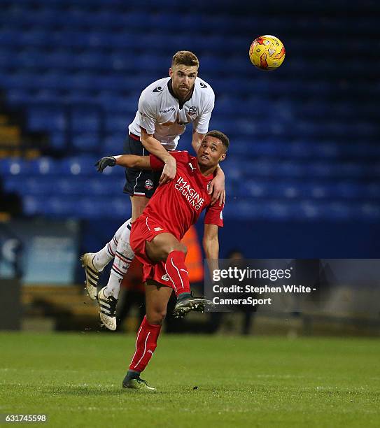 Bolton Wanderers' Mark Beevers climbs above Swindon Town's Jermaine Hylton during the Sky Bet League One match between Bolton Wanderers and Swindon...