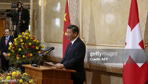 Chinese President Xi Jinping delivers a speech at the House of Parliament 'Bundeshaus' in Bern, as part of his two-day state visit to Switzerland, on...