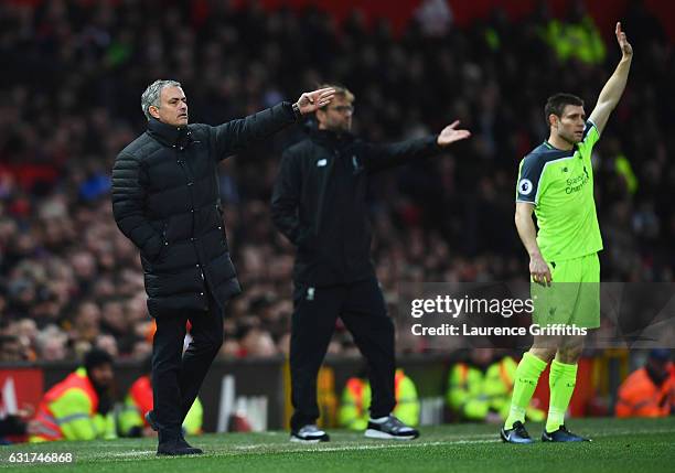 Jose Mourinho manager of Manchester United, Jurgen Klopp manager of Liverpool and James Milner of Liverpool appeal during the Premier League match...