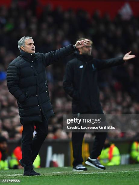 Jose Mourinho manager of Manchester United and Jurgen Klopp manager of Liverpool appeal during the Premier League match between Manchester United and...