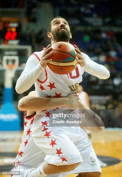 Vladimir Stimac helps Arda Turan to score basket during Spor Toto All - Star 2017 match between the Europe and Asia teams at Ulker Sports Arena in...