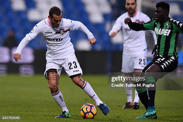 Alessandro Diamanti and Alfred Duncan of Sassuolo compete for the ball during the Serie A match between US Sassuolo and US Citta di Palermo at Mapei...