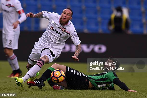 Michel Morganella of Palermo and Luca Mazzitelli of Sassuolo compete for the ball during the Serie A match between US Sassuolo and US Citta di...