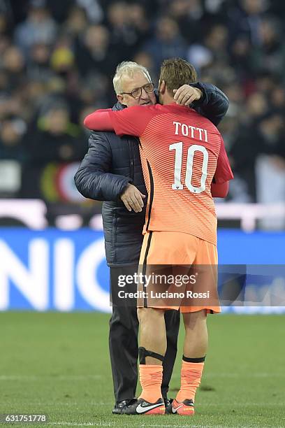 Roma player Francesco Totti greets Udinese Calcio coach Luigi Delneri before the Serie A match between Udinese Calcio and AS Roma at Stadio Friuli on...