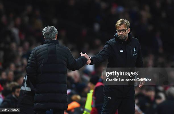 Jose Mourinho manager of Manchester United and Jurgen Klopp manager of Liverpool shake hands after the Premier League match between Manchester United...