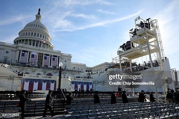 The center camera stand rises in front of the stage where President-elect Donald Trump with be sworn in during a dress rehersal for the inguration...