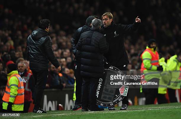 Jose Mourinho manager of Manchester United and Jurgen Klopp manager of Liverpool argue on the touchline the Premier League match between Manchester...