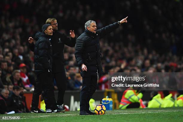 Jose Mourinho manager of Manchester United and Jurgen Klopp manager of Liverpool react during the Premier League match between Manchester United and...