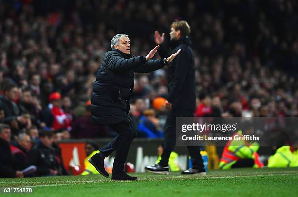 Jose Mourinho manager of Manchester United and Jurgen Klopp manager of Liverpool react during the Premier League match between Manchester United and...