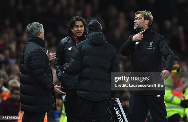 Jose Mourinho manager of Manchester United and Jurgen Klopp manager of Liverpool argue on the touchline the Premier League match between Manchester...