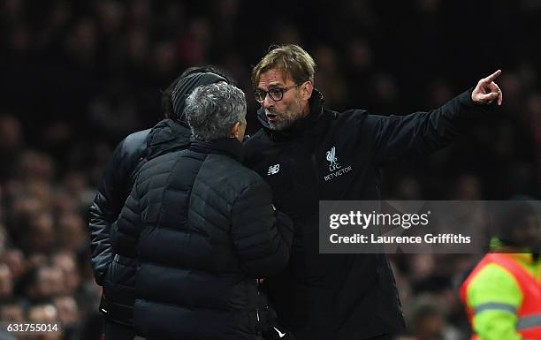 Jose Mourinho manager of Manchester United and Jurgen Klopp manager of Liverpool argue on the touchline the Premier League match between Manchester...