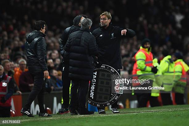 Jose Mourinho manager of Manchester United and Jurgen Klopp manager of Liverpool argue on the touchline the Premier League match between Manchester...