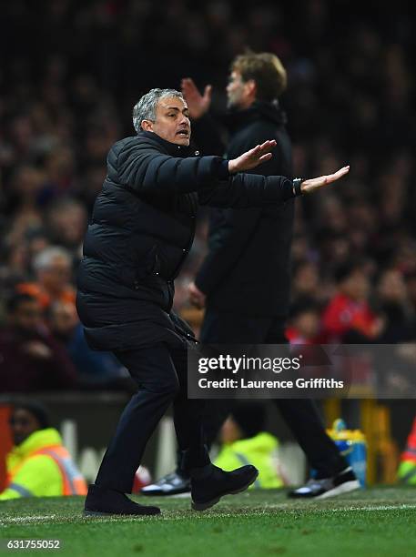 Jose Mourinho manager of Manchester United and Jurgen Klopp manager of Liverpool react during the Premier League match between Manchester United and...
