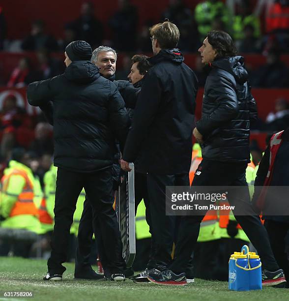 Manager Jose Mourinho of Manchester United clashes with Manager Jurgen Klopp of Liverpool during the Premier League match between Manchester United...