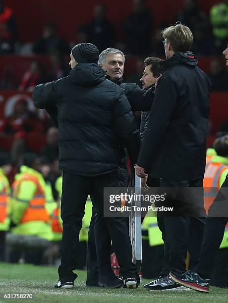 Manager Jose Mourinho of Manchester United clashes with Manager Jurgen Klopp of Liverpool during the Premier League match between Manchester United...