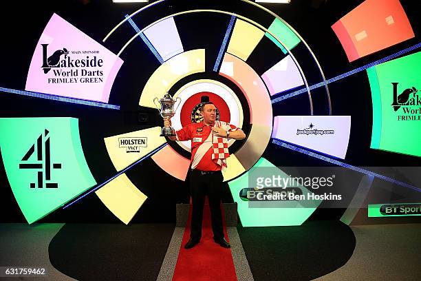 Glen Durrant of England celebrates with the trophy after defeating Danny Noppert of The Netherlands in the final of The BDO Lakeside World...