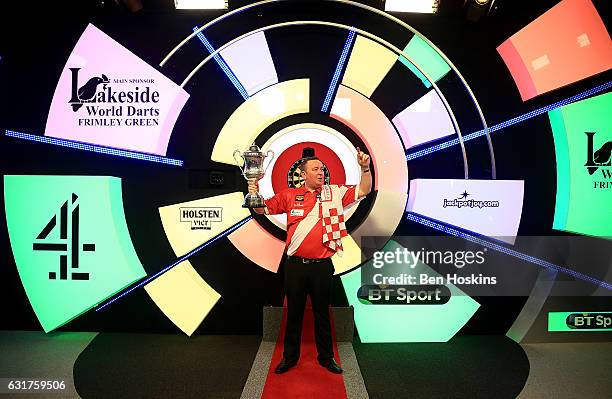 Glen Durrant of England celebrates with the trophy after defeating Danny Noppert of The Netherlands in the final of The BDO Lakeside World...