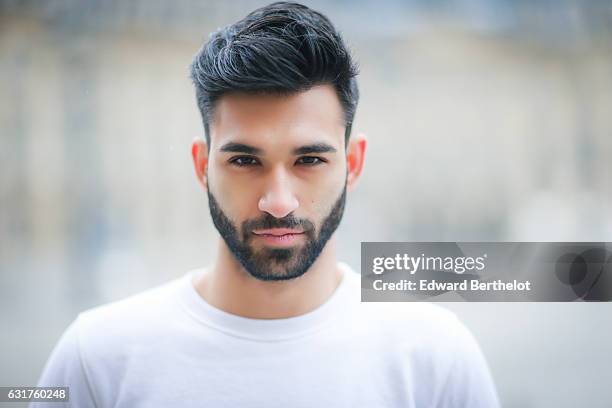 Anil Brancaleoni, life style blogger and Youtuber from the channel Wartek, is wearing Tod's brown denim shoes, Replay black pants, and a Basus white...