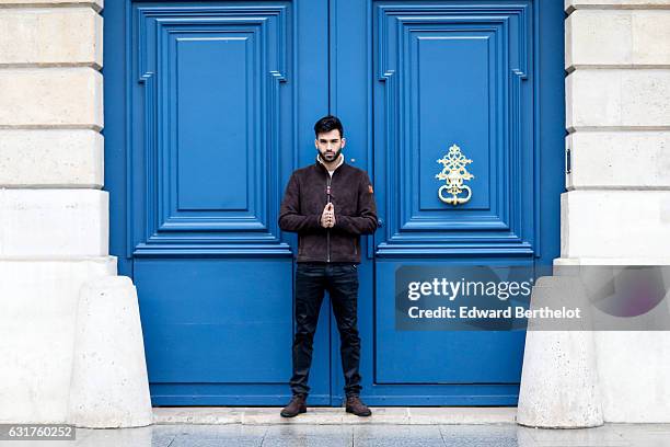 Anil Brancaleoni, life style blogger and Youtuber Wartek, is wearing Tod's brown denim shoes, Replay black pants, and a Napapijri coat, on January...